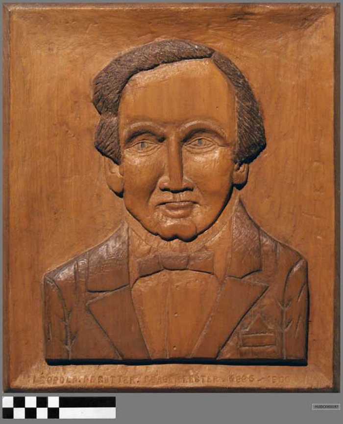 Houten paneel met in in houtsnijwerk het portret van burgemeester Leopold Desutter